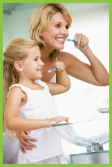 Mum and daughter cleaning teeth
