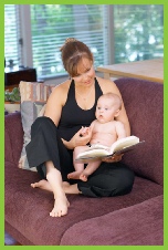 mother with baby on sofa